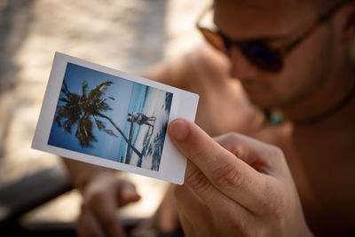 Close-up of woman photographing with camera