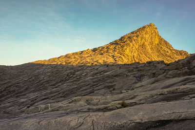 Scenic view of rocky mountains against sky