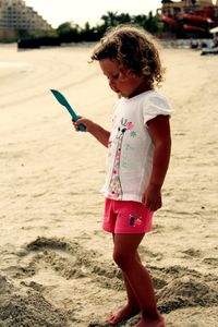 Full length of girl standing at beach