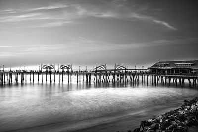 Pier over sea against sky