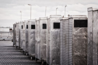 Abandoned baggage containers at harbor