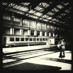 Full length of man standing at railroad station