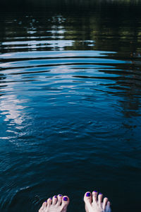 Low section of woman in swimming pool