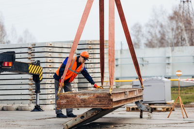 Engineer working with metal at site