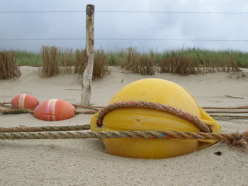 Buoys and rope on beach