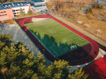 High angle view of soccer field by road