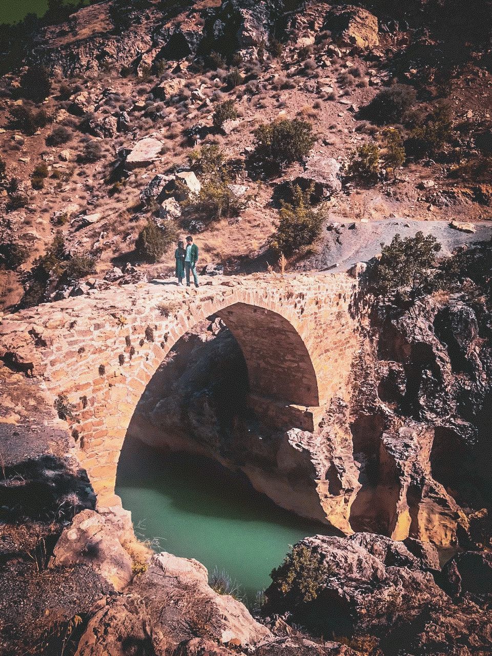 rock, nature, solid, rock - object, water, rock formation, real people, arch, beauty in nature, day, leisure activity, lifestyles, tranquility, people, architecture, sunlight, tranquil scene, outdoors, natural arch