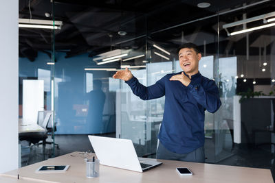 Rear view of businessman working in office