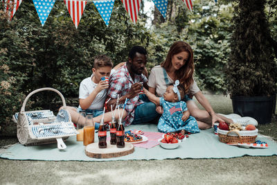 Group of people sitting on table