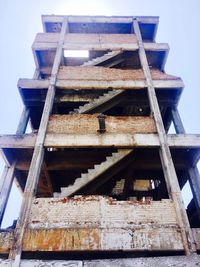 Low angle view of construction site against sky