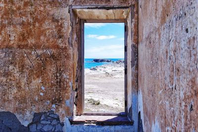 Sea seen through old window