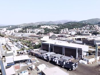 High angle view of buildings in city against sky