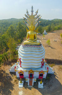 View of cross on tree against sky