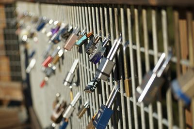 Close-up of padlocks on railing