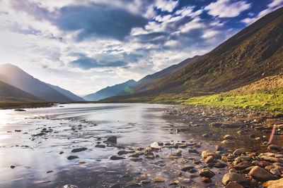 Scenic view of lake and mountains against sky