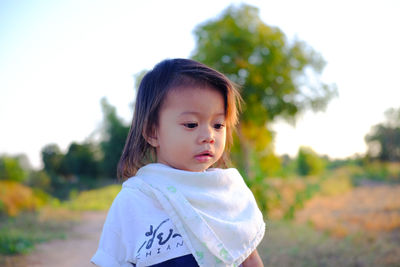 Portrait of cute girl standing outdoors