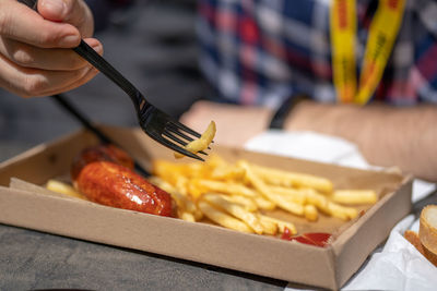 Close-up of person holding food