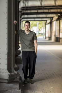 Portrait of mature man standing at walkway