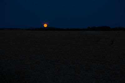 Scenic view of silhouette landscape against sky at night