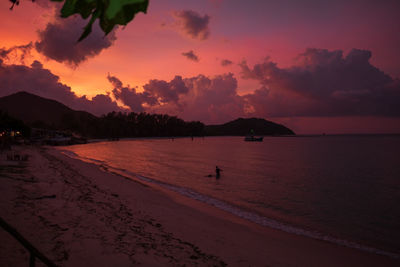 Scenic view of beach against sky during sunset