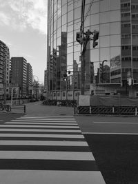 City street and buildings against sky