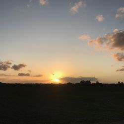 Scenic view of silhouette landscape against sky during sunset