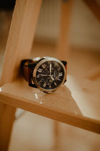 High angle view of clock on table