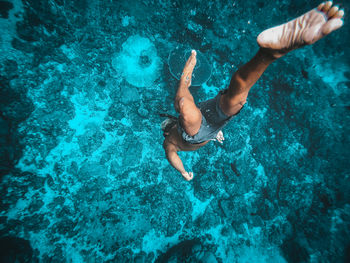 High angle view of man swimming in sea