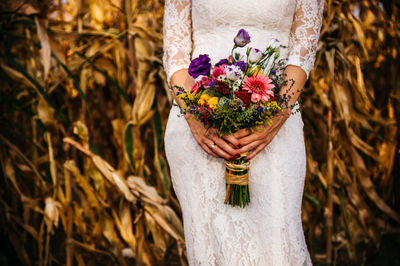 Woman holding flower bouquet