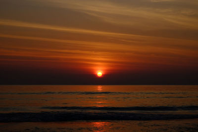 Scenic view of sea against romantic sky at sunset