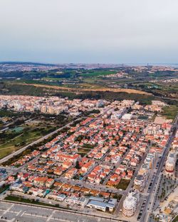 Aerial view of caparica residential district at sunset, setubal, portugal.