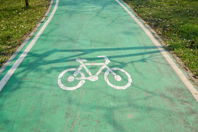 High angle view of bicycle sign on road