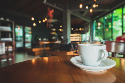 Coffee cup on table in cafe