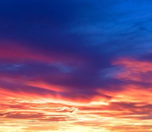 Low angle view of cloudy sky at sunset