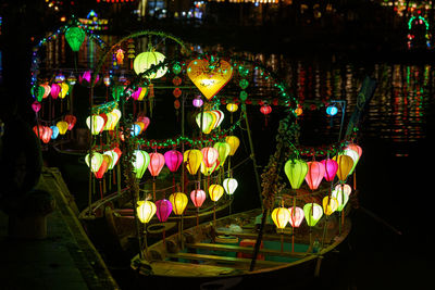 Multi colored illuminated carousel in amusement park