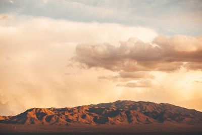 Scenic view of mountains against sky during sunset