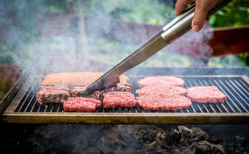 Close-up of meat cooking on barbecue grill