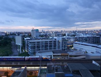 High angle view of buildings in city against sky