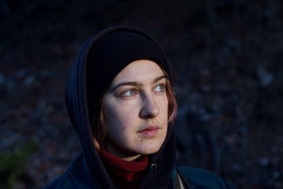 Portrait of young woman wearing hat