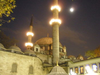 Low angle view of mosque at night