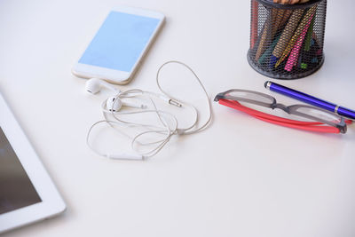 High angle view of smart phone on table