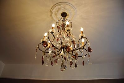 Low angle view of illuminated light bulbs