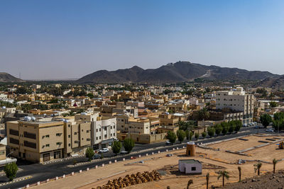 Saudi arabia, hail province, ha’il, desert city with hills in background