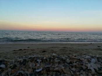 Scenic view of sea against clear sky during sunset