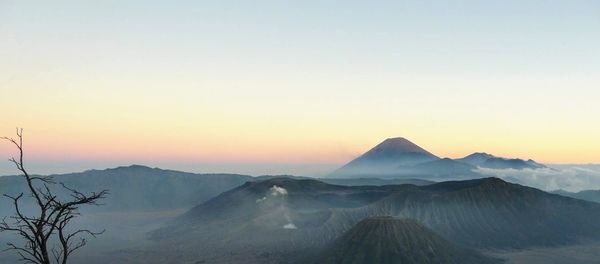 Scenic view of mountains against sky during sunset