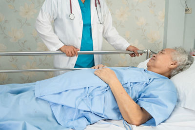 Doctor examining patient in hospital