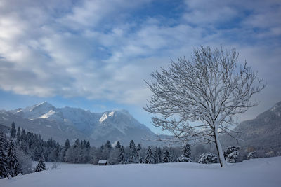 Scenic view of snowcapped mountains against sky