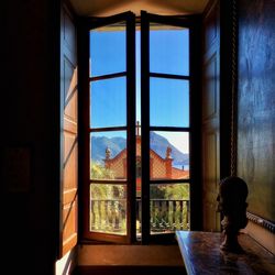 Man looking through window