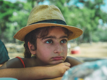 Close-up portrait of boy wearing hat