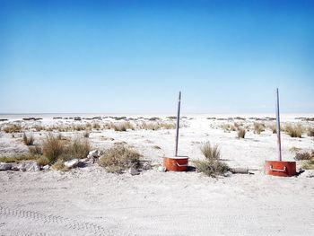 Scenic view of land against clear sky during winter
